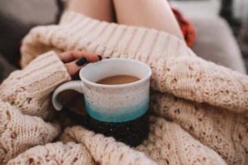 hygge woman in woolly jumper with cup of tea